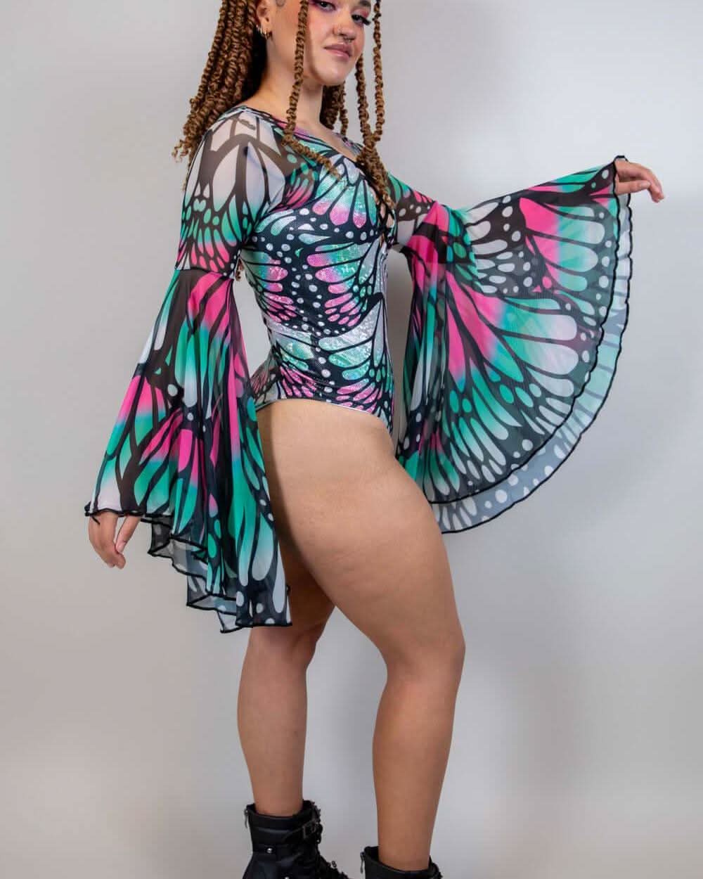 Rave bodysuit with butterfly wing sleeves in turquoise and pink Flutter Goddess pattern, festival outfit front view