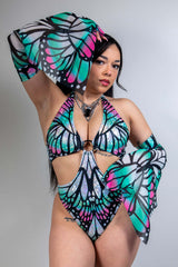Model showcasing Flutter Metamorphosis Sleeves with a butterfly pattern, perfect for rave outfits and clothing.
