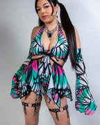 Model wearing Flutter butterfly print rave bodysuit with matching arm sleeves in turquoise and pink holographic colors
