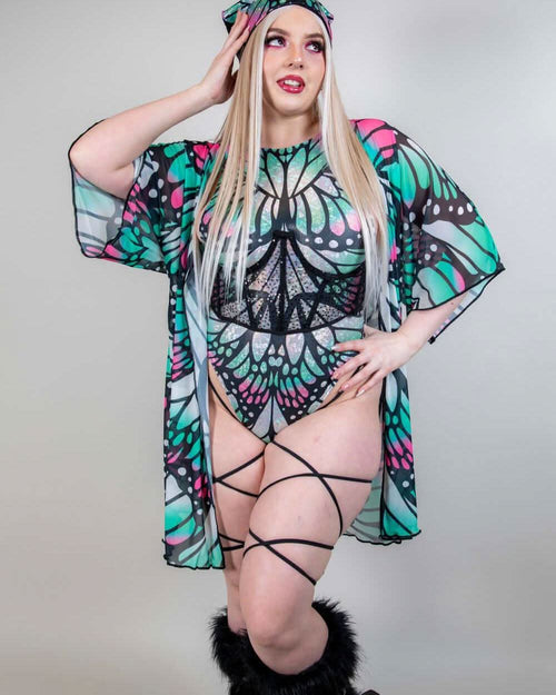 Model wearing a Flutter Short Mesh Robe, showcasing vibrant butterfly design and stylish rave outfits.