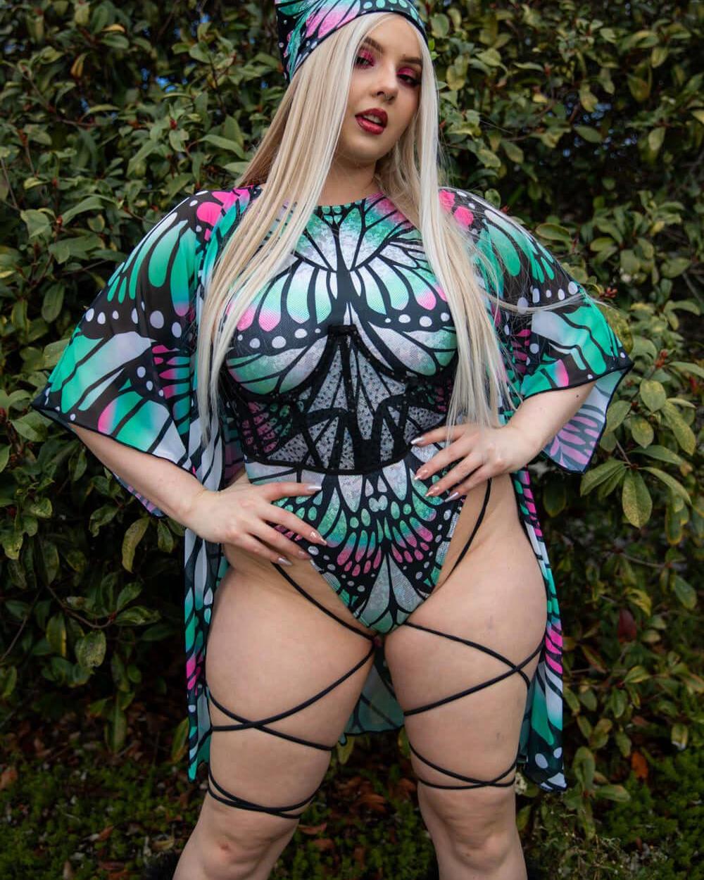 Model showcasing Flutter Sideboob Bodysuit with leg straps and butterfly print, perfect for rave outfits and clothing.