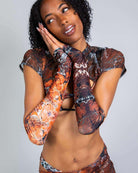 Model showcasing Fossil Arm Sleeves, perfect for rave outfits, demonstrating cozy and stylish fit.