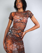 Model showcasing the Fossil Mesh Baby Tee Maxi Dress, perfect for stylish rave outfits with a breathable, fitted design.