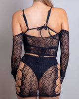 Model showcasing Gothic Glamour Lace Set with fishnet and lace details, perfect for rave outfits and sultry looks.