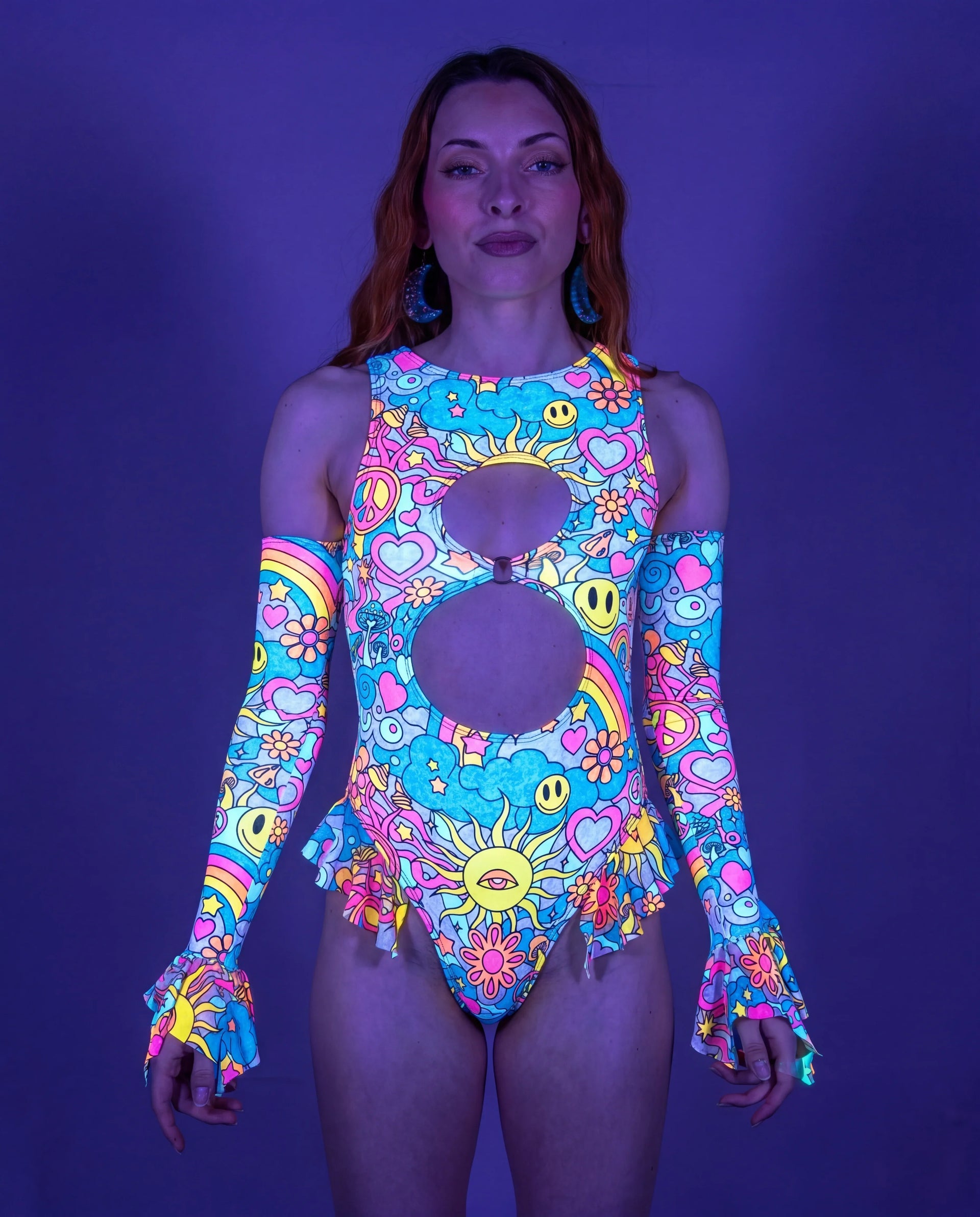 Groovy Spellcaster Arm Sleeves on a model, front view, showcasing the vibrant pastel psychedelic rave print. — UV blacklight