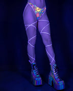 Groovy Strappy High Hip Bottoms in a psychedelic sun and floral pattern with lavender straps, worn by a model from the front, perfect for rave festivals. — UV blacklight