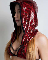 Red sequined Heartbreaker Assassin Hood with chain, worn as a festival accessory for rave outfits.