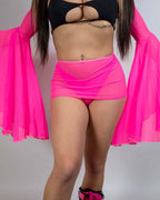 Hot pink mesh rave skirt worn with black top and sheer kimono sleeves festival outfit front view