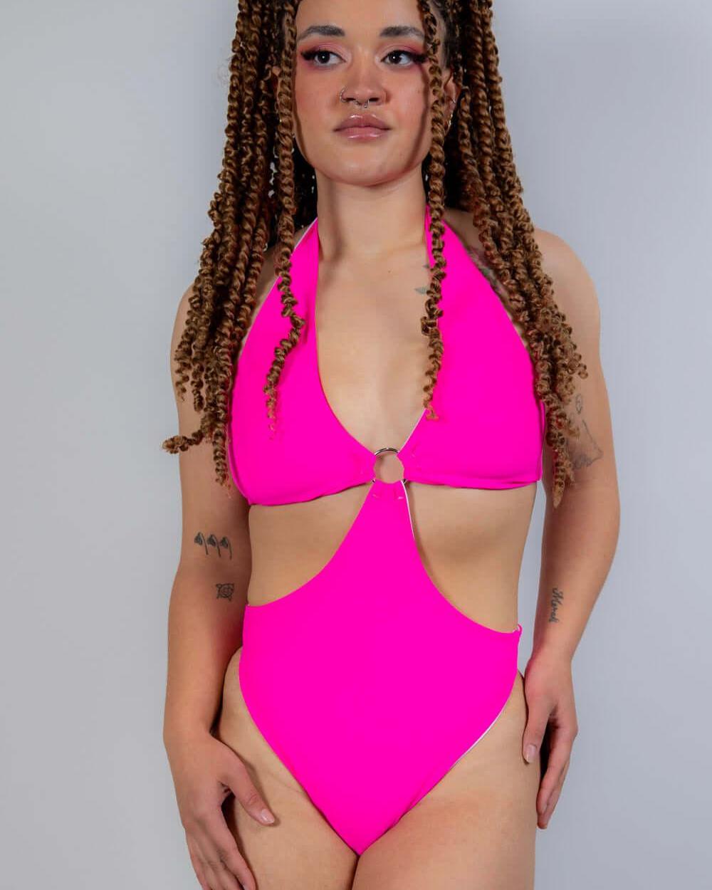 Full-body front view of the Hot Pink O-Ring Bodysuit, emphasizing its bold cut and eye-catching festival look.