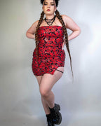 Red holographic Inferno rave bodysuit dress with flame pattern, festival outfit front view on model