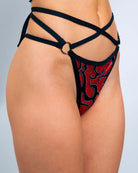 Side view of Inferno Expose Bottoms featuring strappy design and o-ring detail, perfect for rave outfits.