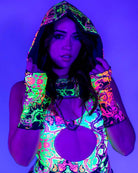 Fashionable woman in Intensity Assassin Hood showcasing trippy UV print for rave outfits.