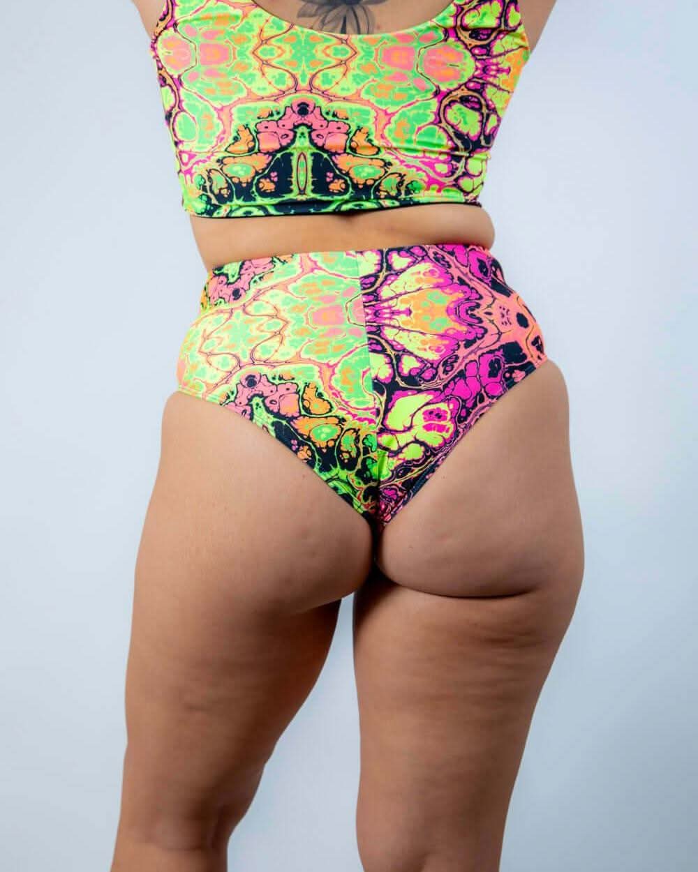 Intensity High Waisted Bikini Bottoms in vibrant trippy UV fabric, perfect for rave outfits and stylish dance comfort.