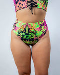 High waisted bikini bottoms in vibrant trippy UV design, perfect for rave outfits and flattering comfort.