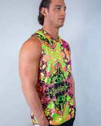 Male model wearing Intensity hooded rave bodysuit tank in neon psychedelic print, festival outfit side profile view