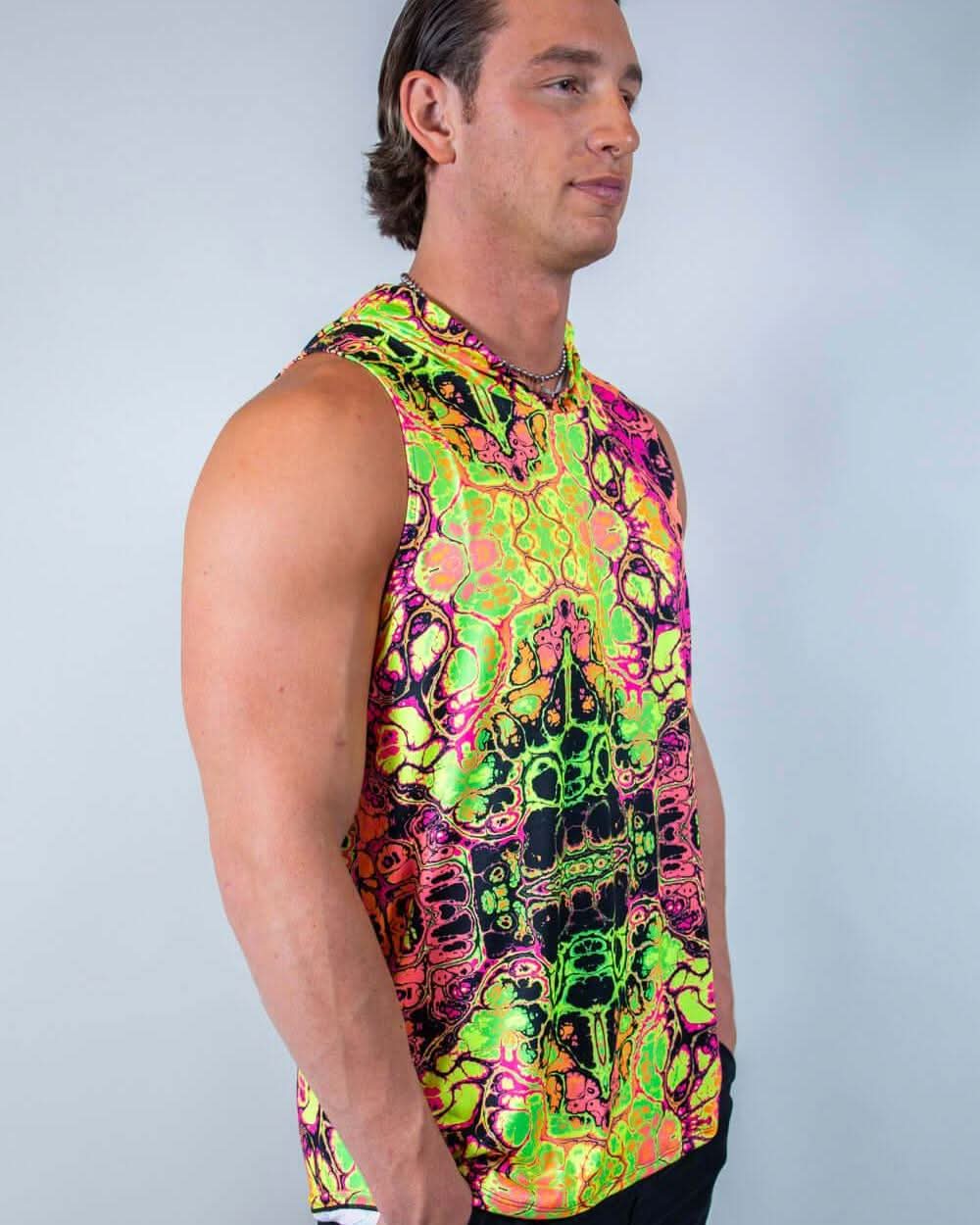 Male model wearing Intensity hooded rave bodysuit tank in neon psychedelic print, festival outfit side profile view