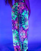 Colorful rave pants with neon skull print, perfect for festivals and comfortable loose fit.