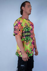 Man wearing a vibrant Intensity Oversized Softee t-shirt, featuring a colorful UV reactive print, ideal for rave outfits.