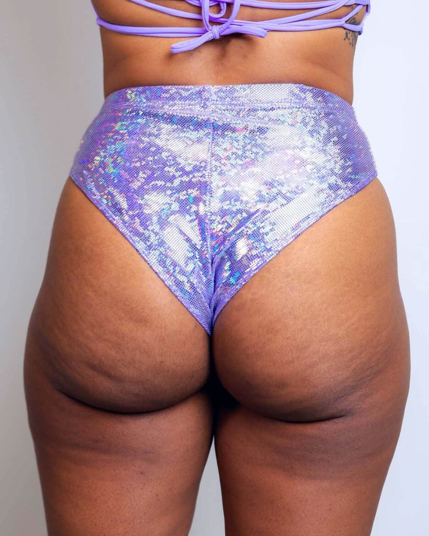 High-waisted lavender holographic Brazilian bottoms showcasing a cheeky cut, perfect for rave outfits.