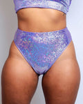 Shimmering lavender high-waisted Brazilian bottoms perfect for rave outfits, featuring a cheeky cut and sparkly design.
