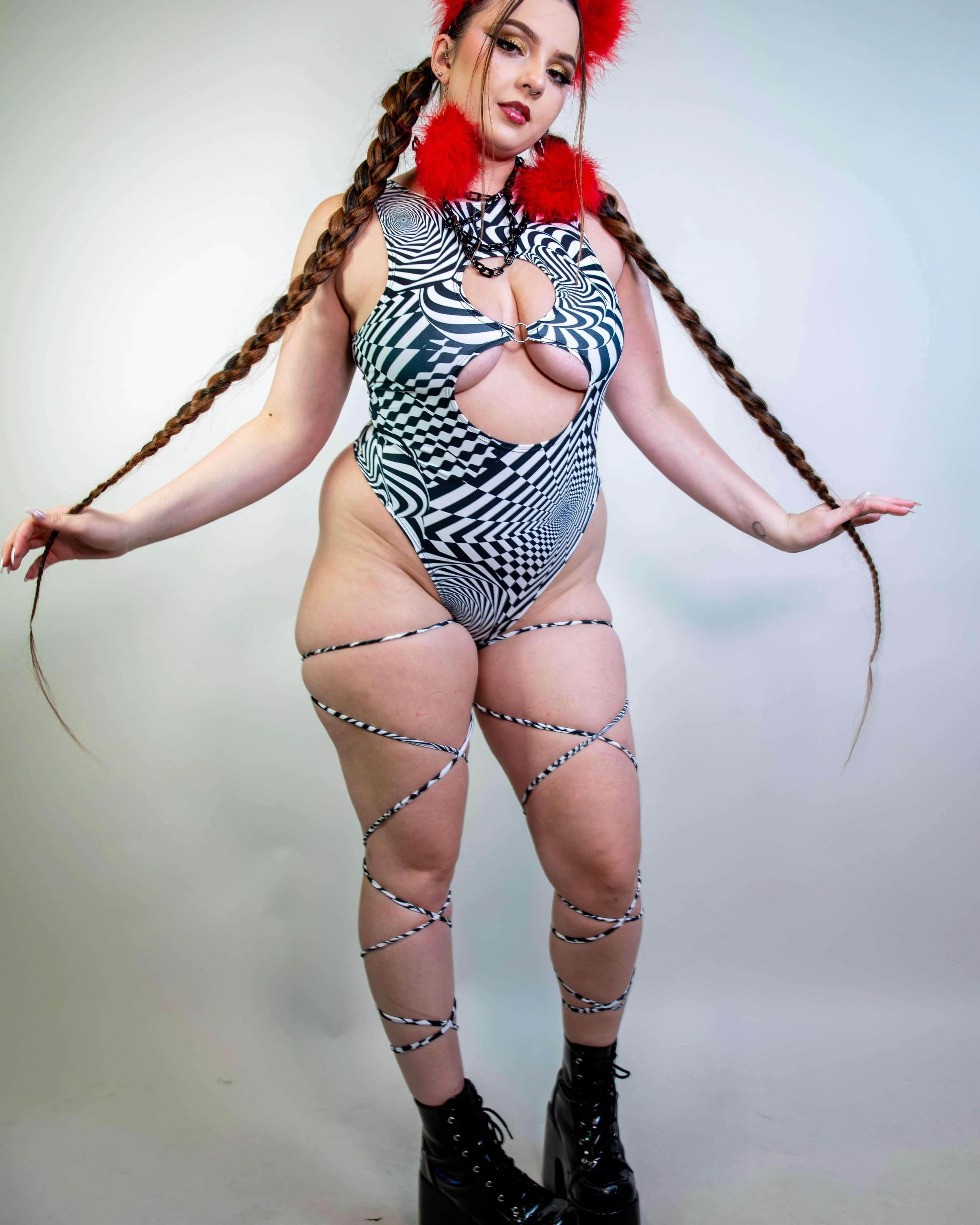 Model styling the Distortion Leg Wraps with a matching outfit, highlighting their edgy rave-ready appeal.