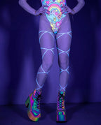 Front view of lilac leg straps on a model, perfect for rave or festival outfits, adding captivating detail. — UV blacklight