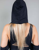 Matte black hood with chain worn by a model, perfect for rave outfits and festival protection.