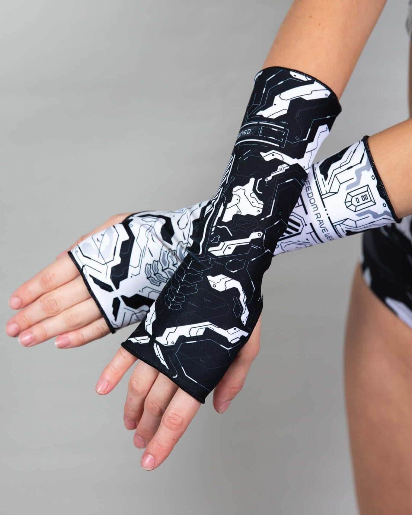 Mechanoid Gloves in black and white with abstract designs, perfect for rave outfits and featuring thumb holes and forearm coverage.