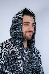 Side profile of the Meltdown Assassin Hood, showing off the curved hem and melty design with a relaxed smile.