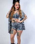 Model styling the Meltdown Festival Scarf with a matching outfit, emphasizing versatility as a fashion-forward rave accessory.