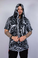 Model wearing the scarf draped with hood style, showing the soft texture and vibrant melty print details.