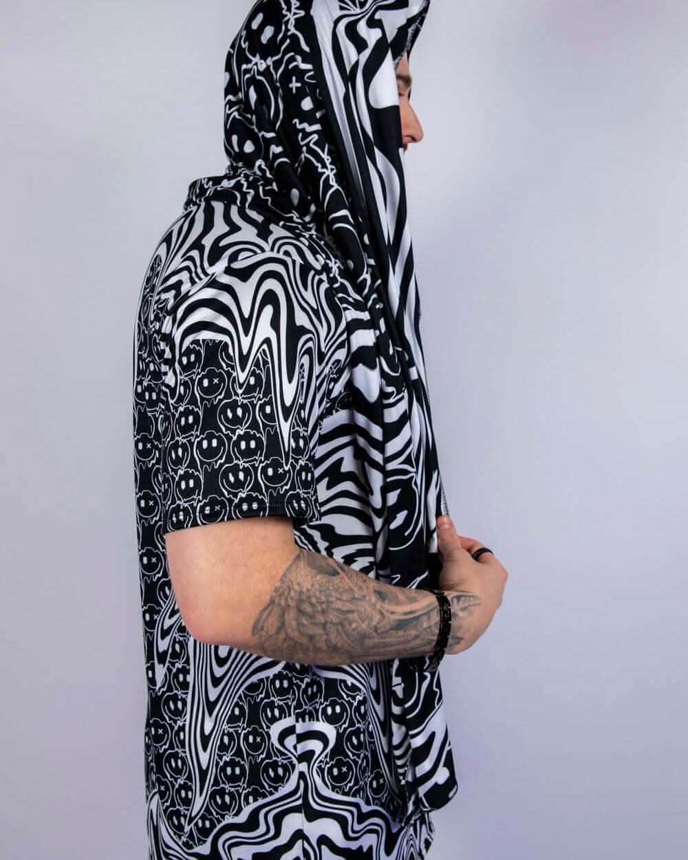 Side profile of the scarf worn hooded, highlighting its flowy fit and unique rave-ready styling options.
