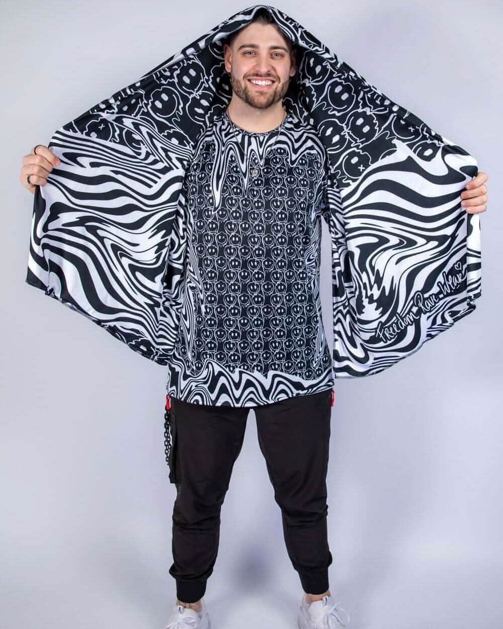 Wide shot of the Meltdown Festival Scarf held out like wings, revealing its full printed surface and breathable material.