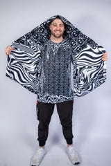 Wide shot of the Meltdown Festival Scarf held out like wings, revealing its full printed surface and breathable material.