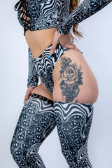 Side angle of the Meltdown High Waisted Thong, showing the cheeky cut and curve-enhancing fit in melty pattern fabric.