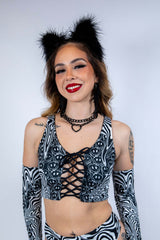 Front-facing view of the Meltdown Lace Up Top, highlighting the lace-up detail and full-length sleeves in a melty pattern.