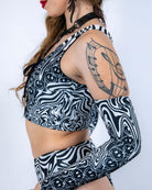 Side profile of the Meltdown Lace Up Top, showing the fit and design details with a focus on the sleeve and lace-up front.