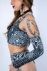 Side profile of the Meltdown Lace Up Top, showing the fit and design details with a focus on the sleeve and lace-up front.