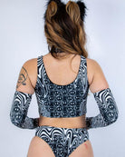 Back view of the Meltdown Lace Up Top, showcasing the scoop back cut and melty trippy print across the shoulders.