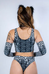 Back view of the Meltdown Lace Up Top, showcasing the scoop back cut and melty trippy print across the shoulders.