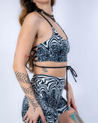 Side profile of the Meltdown Lush Top, showing the halter neckline and adjustable side-tie detail.