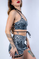 Side profile of the Meltdown Lush Top, showing the halter neckline and adjustable side-tie detail.