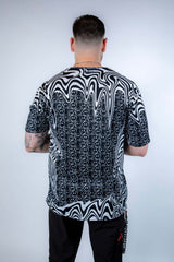 Back view of the Meltdown Oversized Softee, showcasing the full drape of the oversized fit and all-over trippy print.