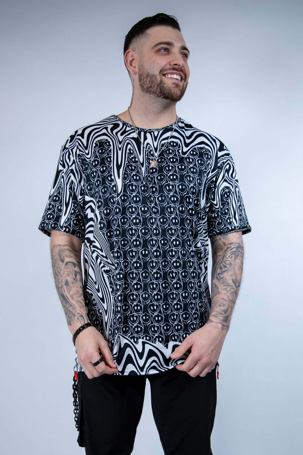 Side-facing view of the Meltdown Oversized Softee, highlighting the loose, breathable fabric and abstract melty pattern.