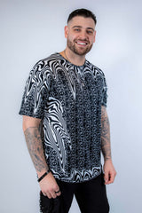 Model wearing the Meltdown Oversized Softee in a casual pose, turned slightly to show both front and side details of the shirt.
