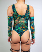 Mesozoic Slit Sideboob Bodysuit with leg straps and jungle print, perfect for rave outfits.