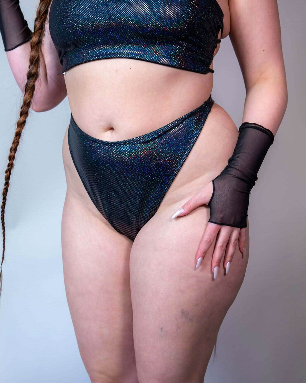Midnight Retro Thong Bottoms in black, high hip cut, feature a cheeky backside perfect for rave outfits.