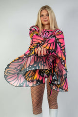 Model showcasing Monarch Mesh Bell Sleeves in vibrant butterfly design, perfect for rave outfits and festival fashion.