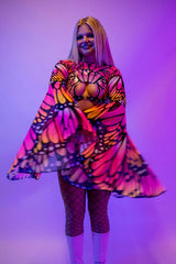 Model wearing vibrant Monarch Mesh Bell Sleeves, showcasing a colorful butterfly design, perfect for rave outfits.