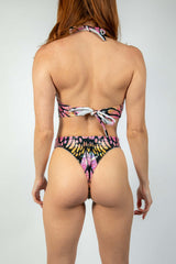 Model wearing the back view of the colorful Monarch O-Ring Bodysuit, perfect for rave outfits and versatile rave clothing.